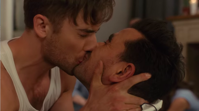 Dan Levy and actor kiss
