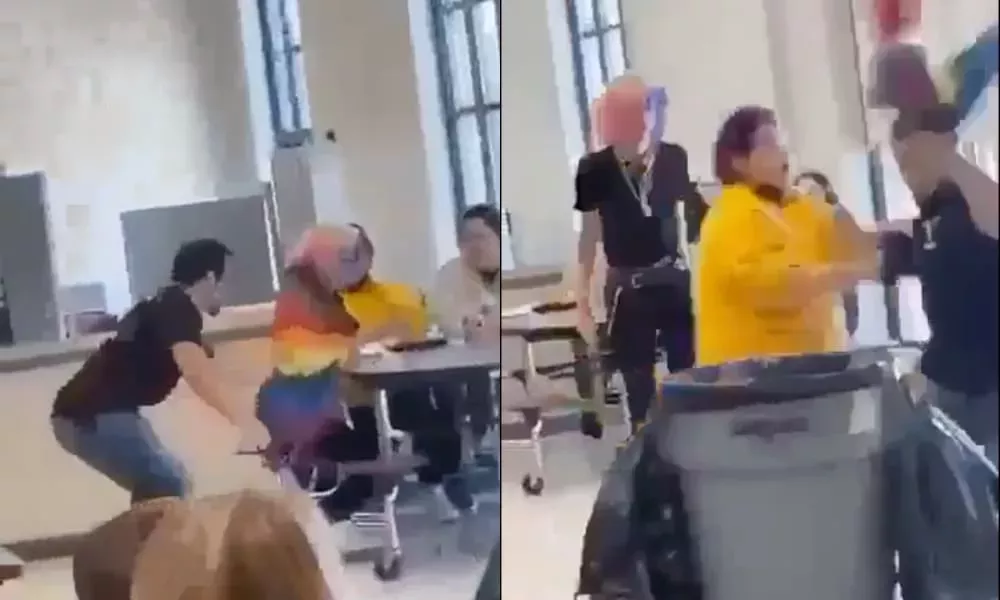 Un acosador golpea a un adolescente por llevar una bandera del Orgullo mientras otros estudiantes sonríen y se ríen