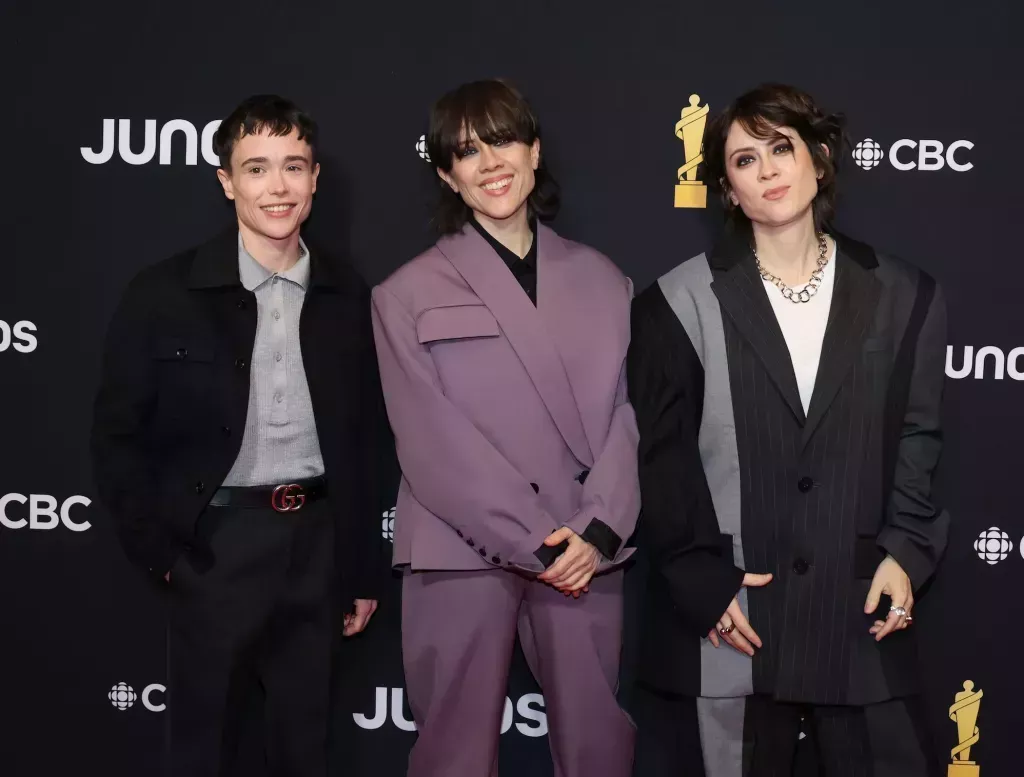 HALIFAX, NOVA SCOTIA - MARCH 24: (L-R) Elliot Page, Sara Quin and Tegan Quin of Tegan and Sara attend the 2024 JUNO Awards at Scotiabank Centre on March 24, 2024 in Halifax, Nova Scotia. (Photo by Cindy Ord/Getty Images)