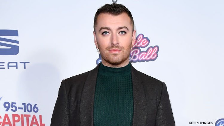Sam Smith on a red carpet.