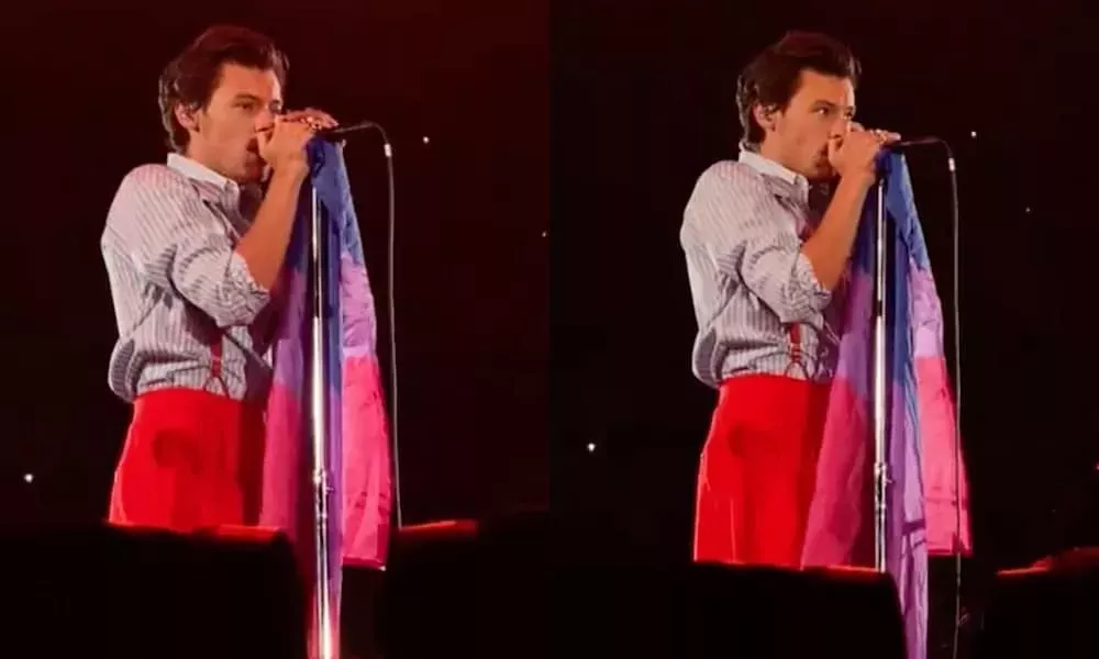 Harry Styles ondea la bandera del Orgullo bisexual en el escenario en un vídeo épico y sus fans están abrumados
