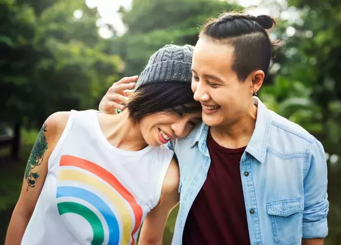 Lesbian couple with rainbow pride shirt