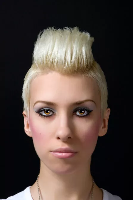 Portrait of a blonde girl with a mohawk haircut