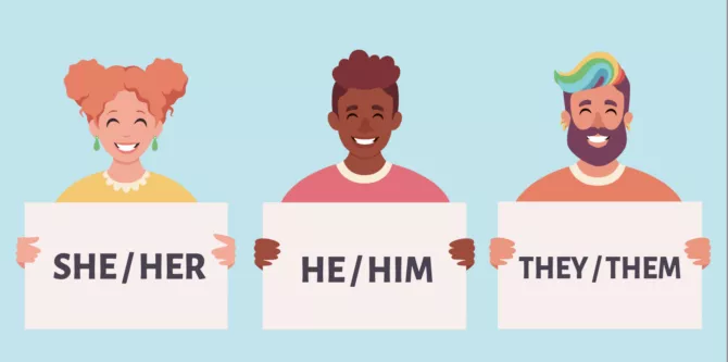 People holding signs with pronouns