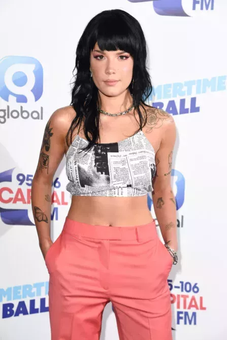 Halsey poses on the media line before performing at the Summertime Ball