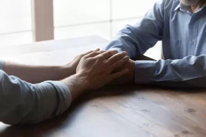 Father and son holding hands