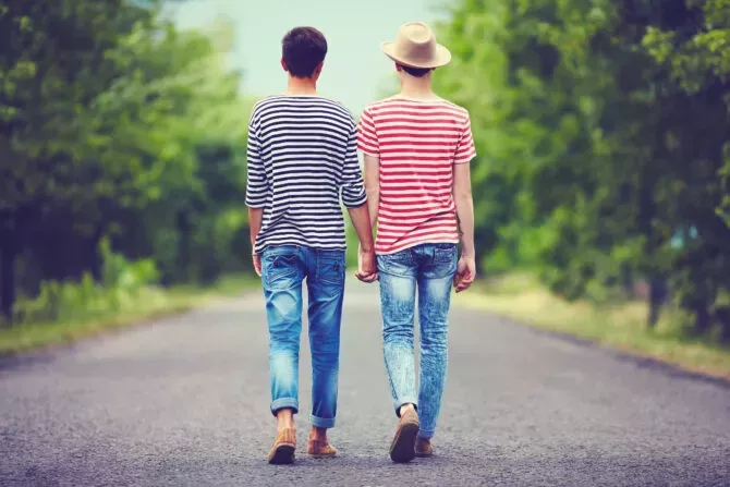 gay couple walking away together
