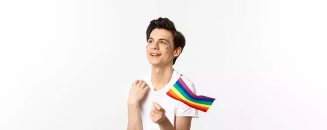 Gay man with rainbow flag