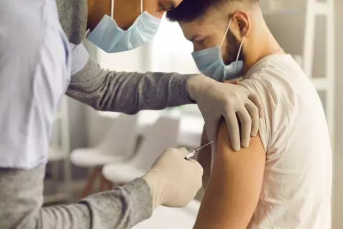 A man is vaccinated