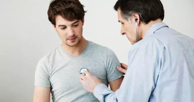 A man is checked by a doctor