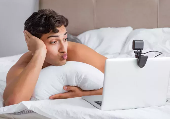 Man puckering up on webcam