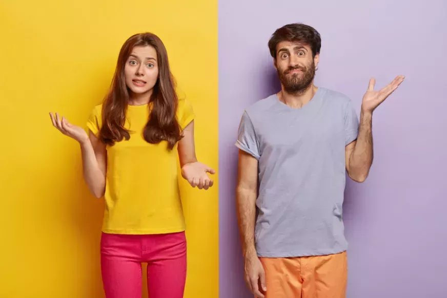 Woman and man shrugging