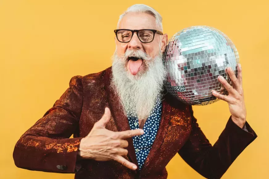 Bearded man celebrating with disco ball