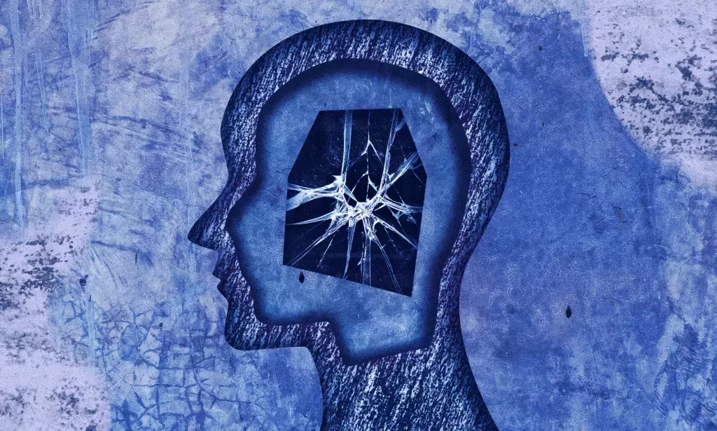 An illustration showing the outline of a person's head, with cracked glass inside