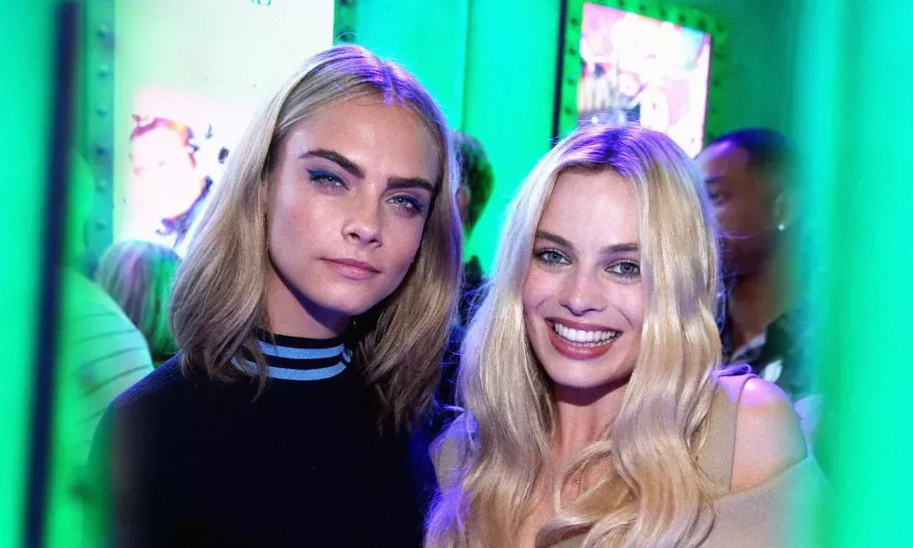 Model Cara Delevigne and actor Margot Robbie pose together