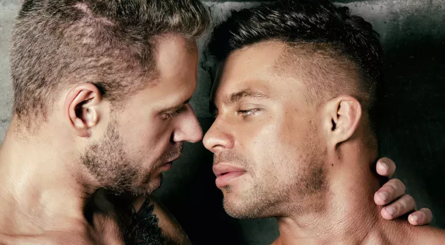 Gay couple about to kiss