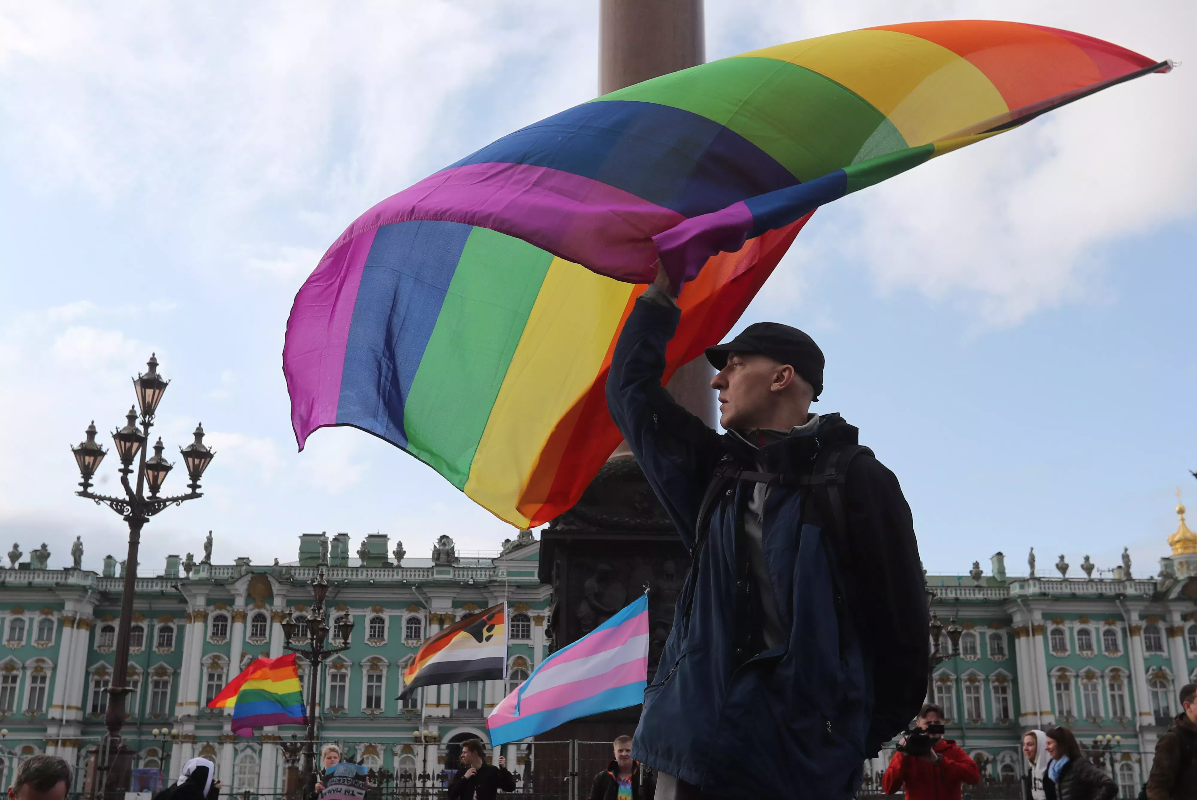 Participant waves rainbow flag during the LGBT community rally "X St.Petersburg Pride" in Saint Petersburg