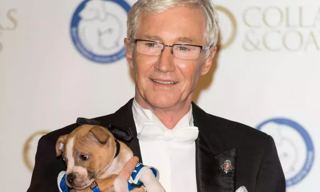 Paul O'Grady holding a puppy