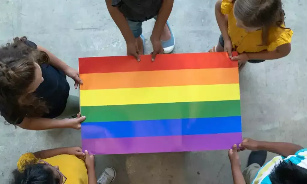 School-age children with Pride flag