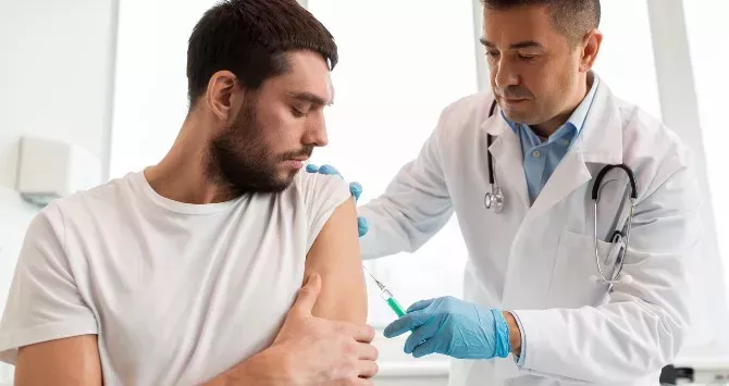 A man gets an mpox vaccine