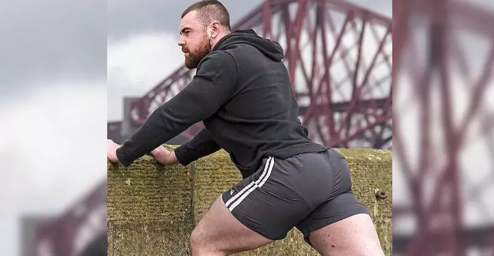 Paul McNulty, aka PJ Knox, shows off his backside.