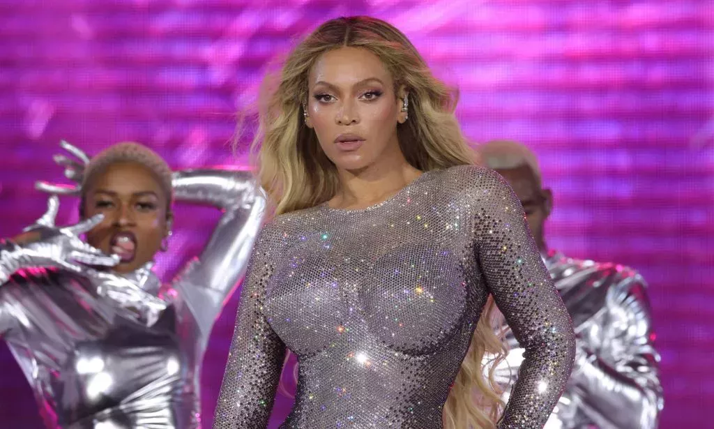 Beyoncé in a silver sparkling bodysuit performing on the Renaissance Tour.