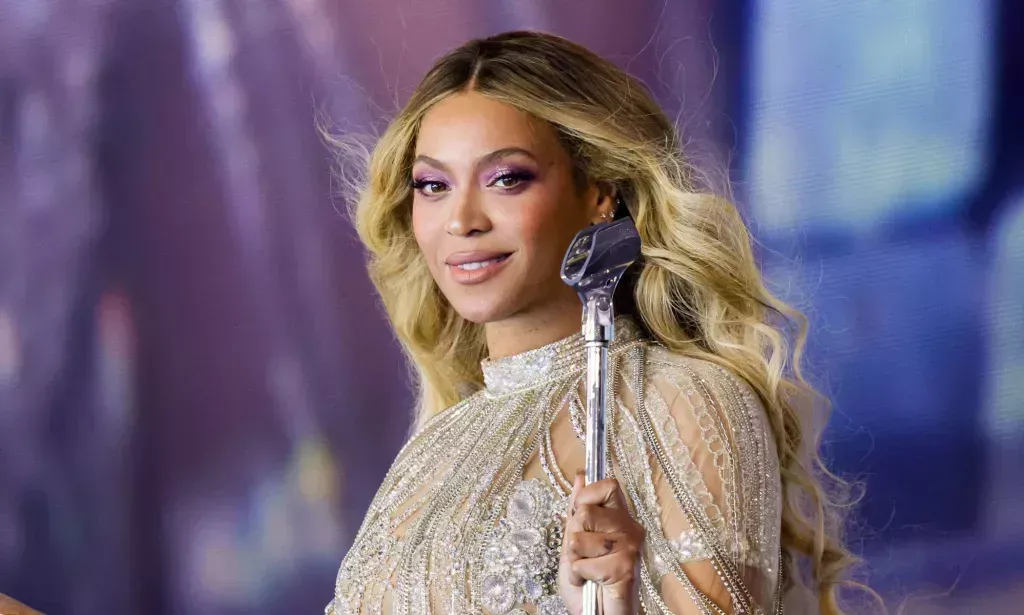 Beyoncé in a silver outfit while performing on the Renaissance tour.