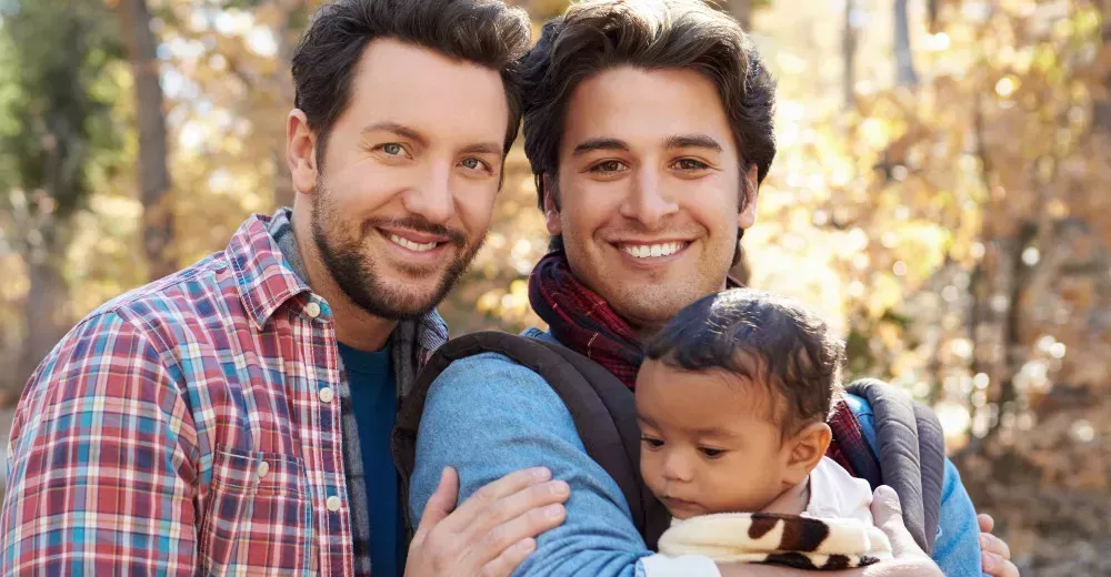 A gay couple with their child