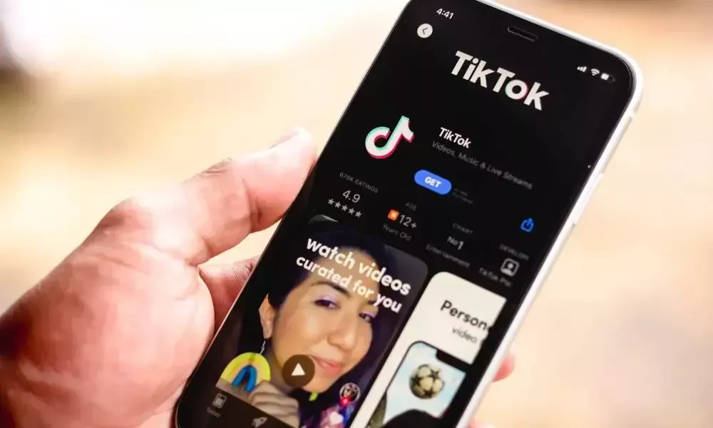 tiktok phone in hands