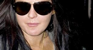 Lindsay Lohan va hecha unos zorros a una sesión de fotos.